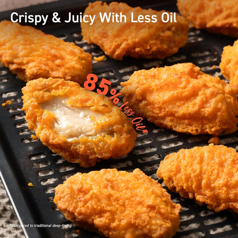 Fried chicken pieces on a grill with text highlighting 'Crispy & Juicy With Less Oil' and '85% less oil'.