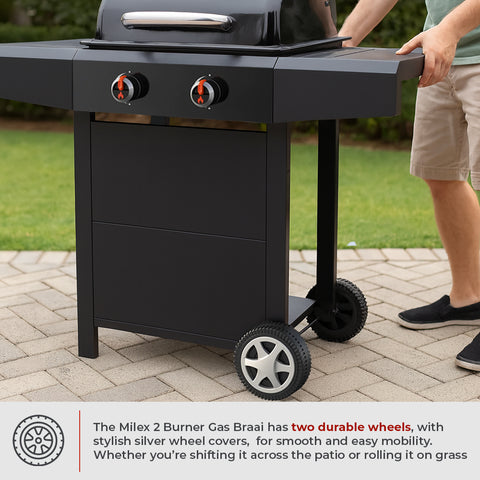Black Milex 2 burner gas braai stand with wheels on a patio, person nearby