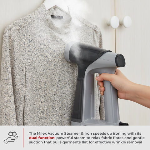 Hand holding a gray handheld steamer over a shirt with text about its dual function.
