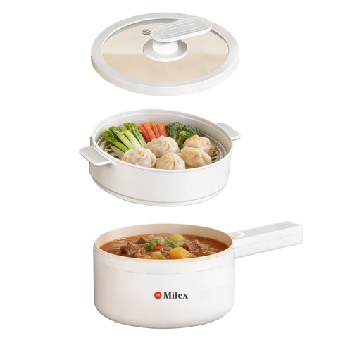 White cookware set with steamed dumplings and vegetable soup on a white background, featuring the Milex brand.