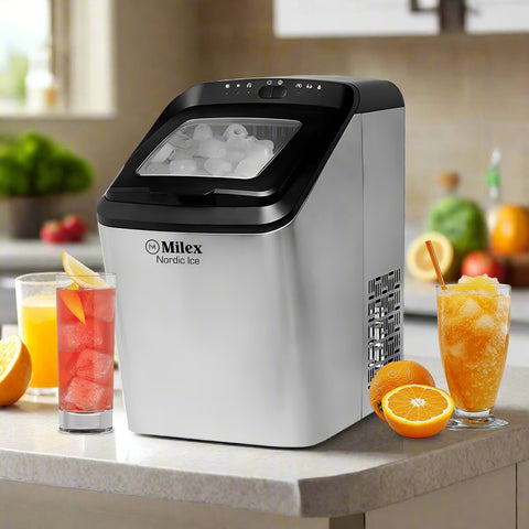 Milex Nordic Ice maker on a kitchen counter with drinks and fruit