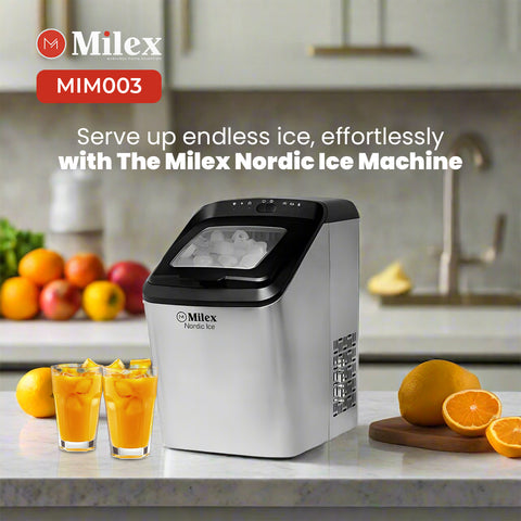 Milex Nordic ice machine on a kitchen counter with fruits and glasses of juice.