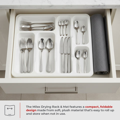 Kitchen drawer with organized silverware and a gray mat, featuring the Milex Drying Rack & Mat.