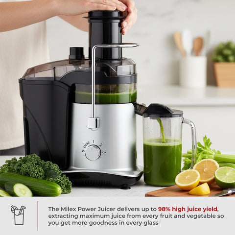 Milex Power Juicer with green juice and fruits on a kitchen counter