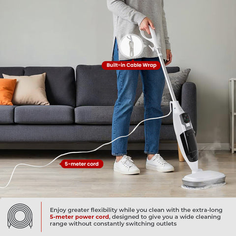 Person using a steam cleaner with a built-in cable wrap in a living room.