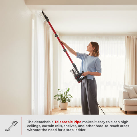 A woman in a living room uses a stick vacuum cleaner with an extended telescopic pipe attachment to clean the ceiling and curtain rail. A text banner at the bottom highlights the telescopic pipe feature.
