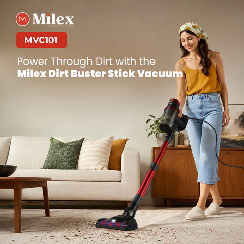 A woman in a yellow top and light blue jeans uses a red and black Milex stick vacuum cleaner to clean a beige carpet in a modern living room setting. The Milex logo and model number MVC101 are displayed in the top left corner.